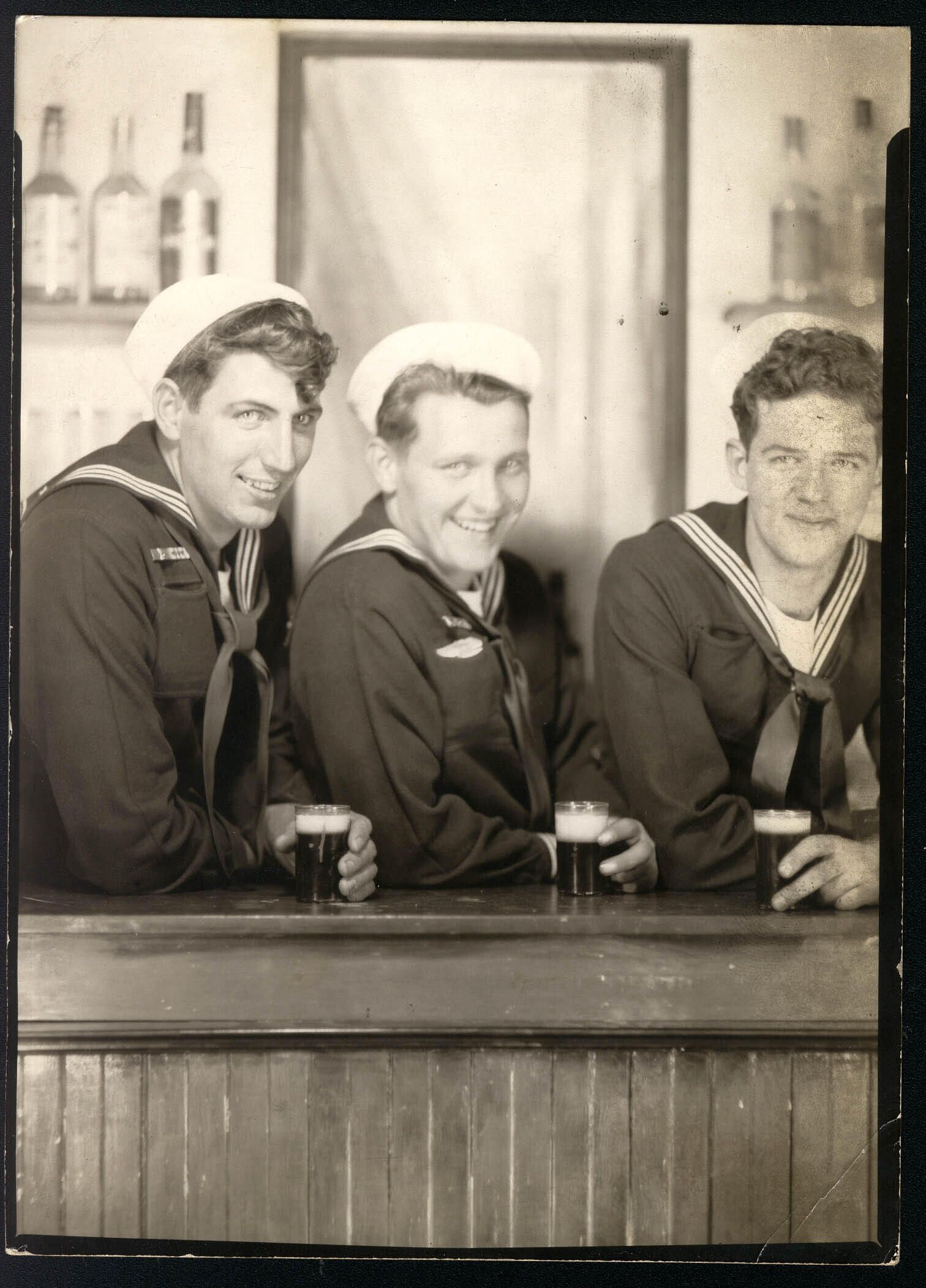 Primary Image of USS Hancock (CV-19) Sailors Enjoying a Beer