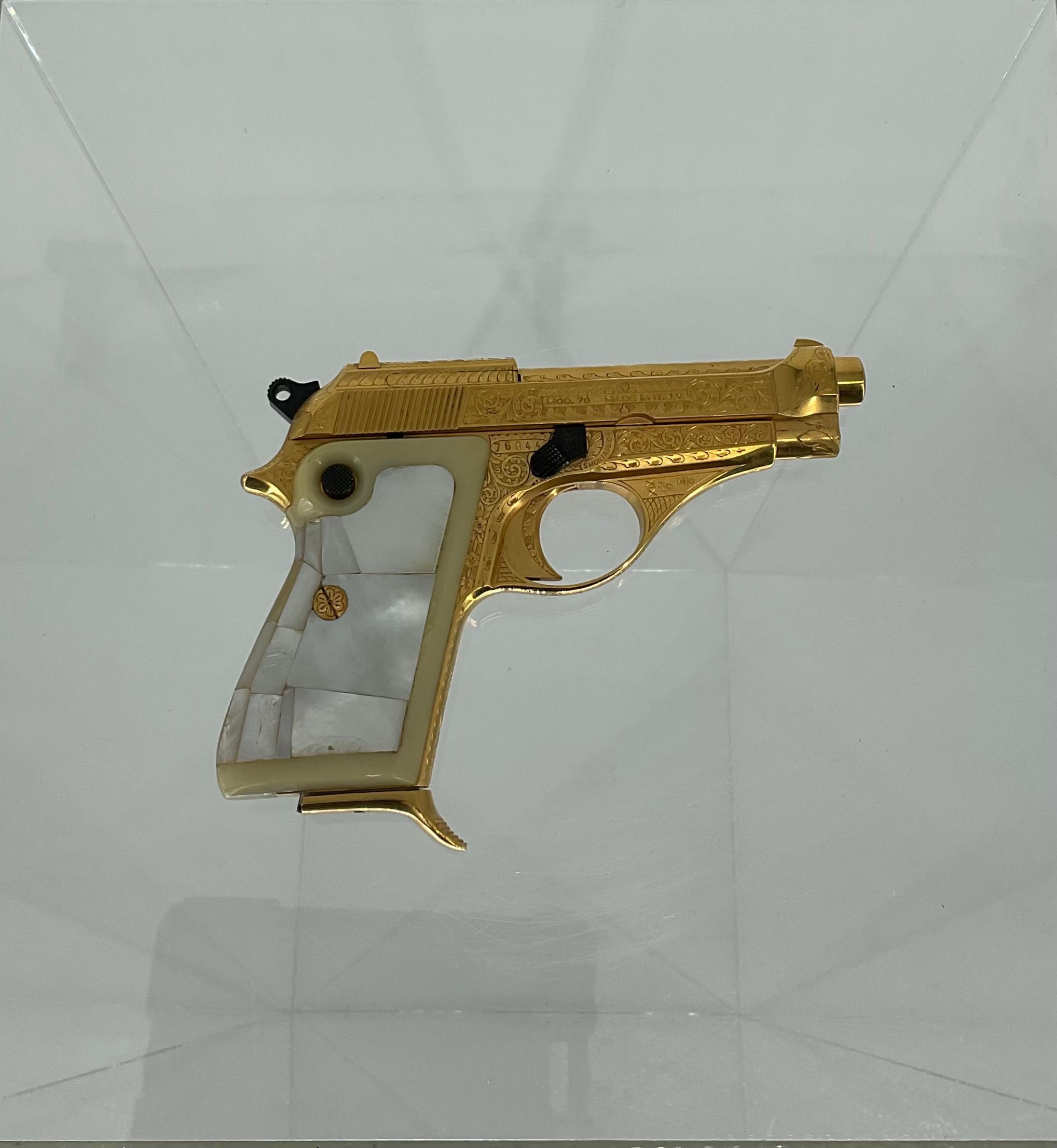 Gold-Plated Beretta of James Cain | Patriots Point Naval & Maritime Museum