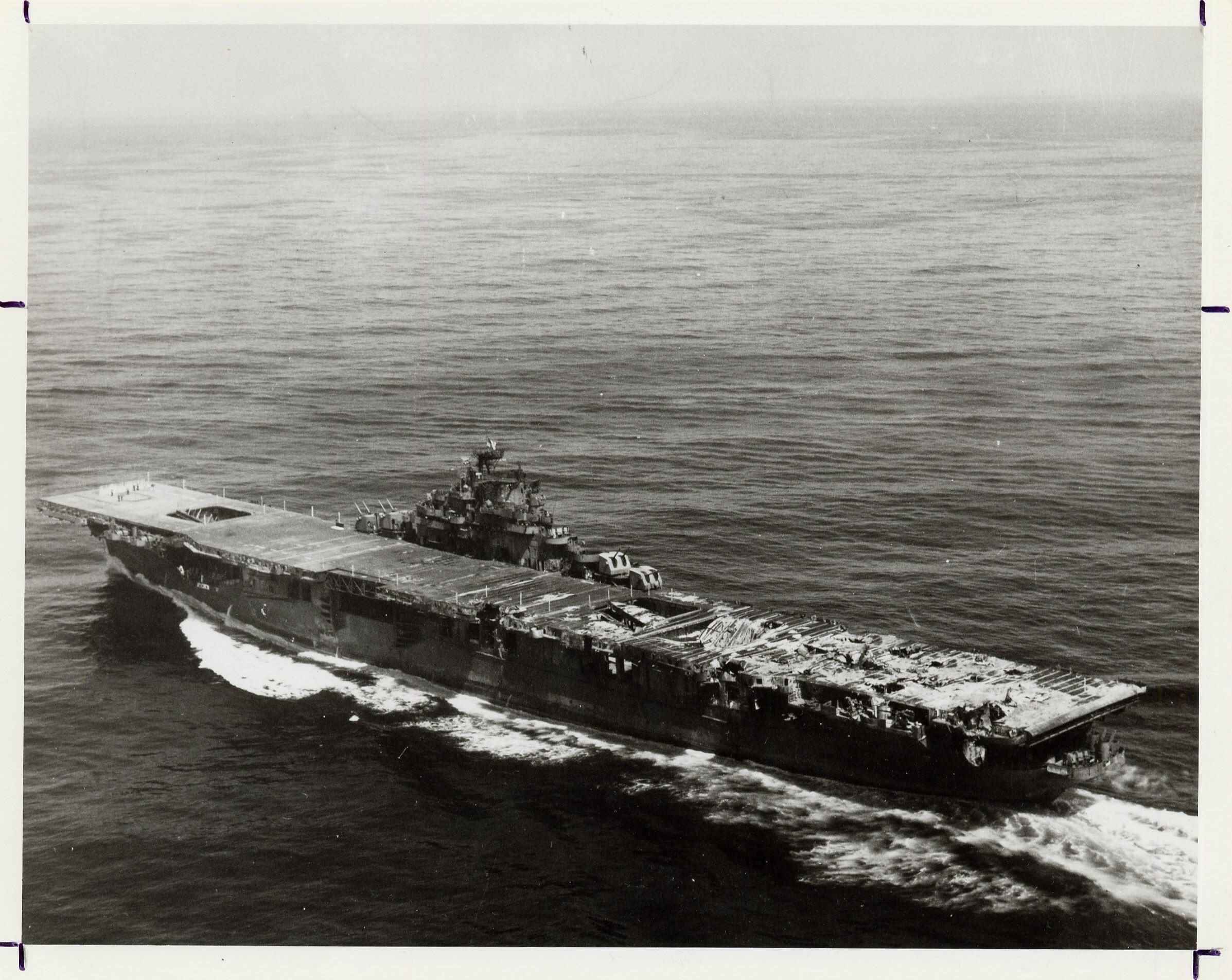 Primary Image of A Damaged USS Franklin (CV-13) Headed Home