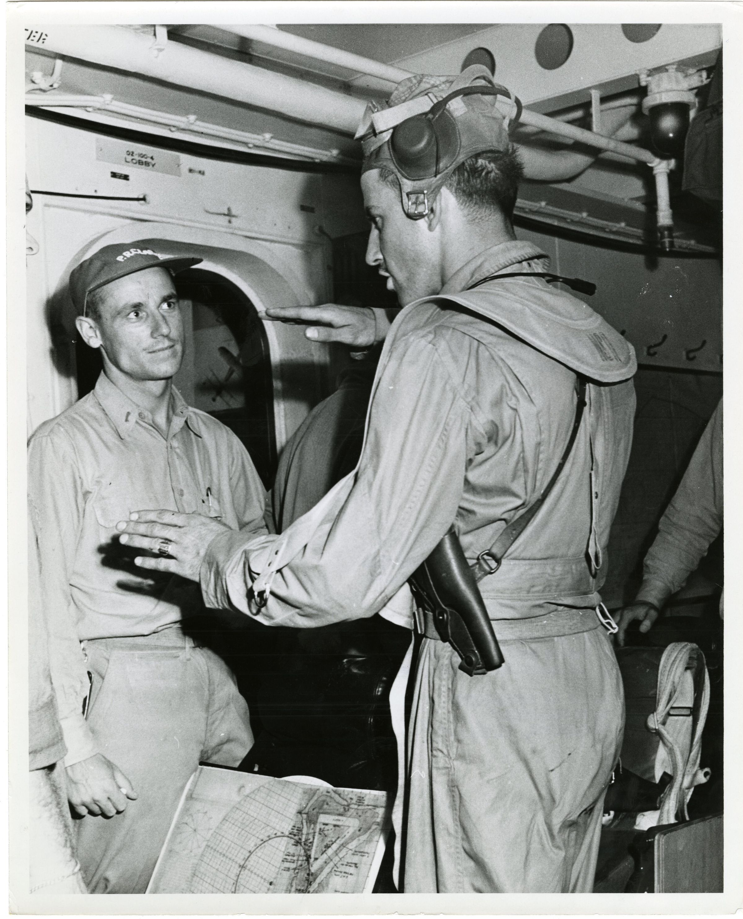 Primary Image of Pilots Discussing Maneuvers and Tactics Aboard The USS Yorktown (CV-10)