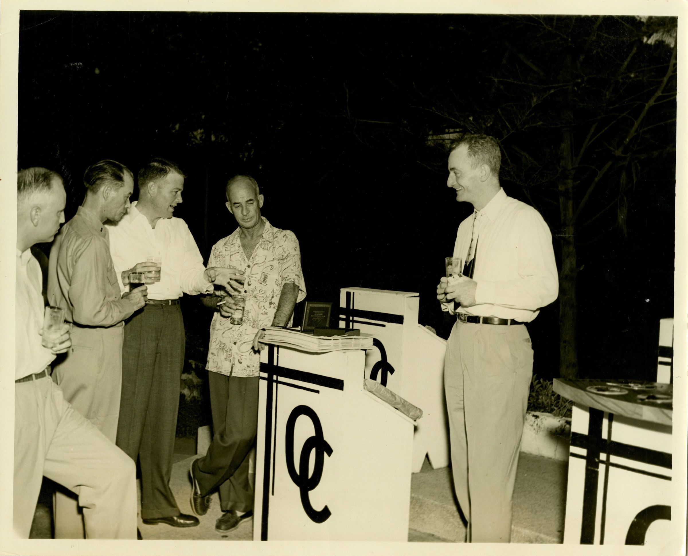 Primary Image of Captain Arnold McKechnie Receiving Gifts at his Farewell Party