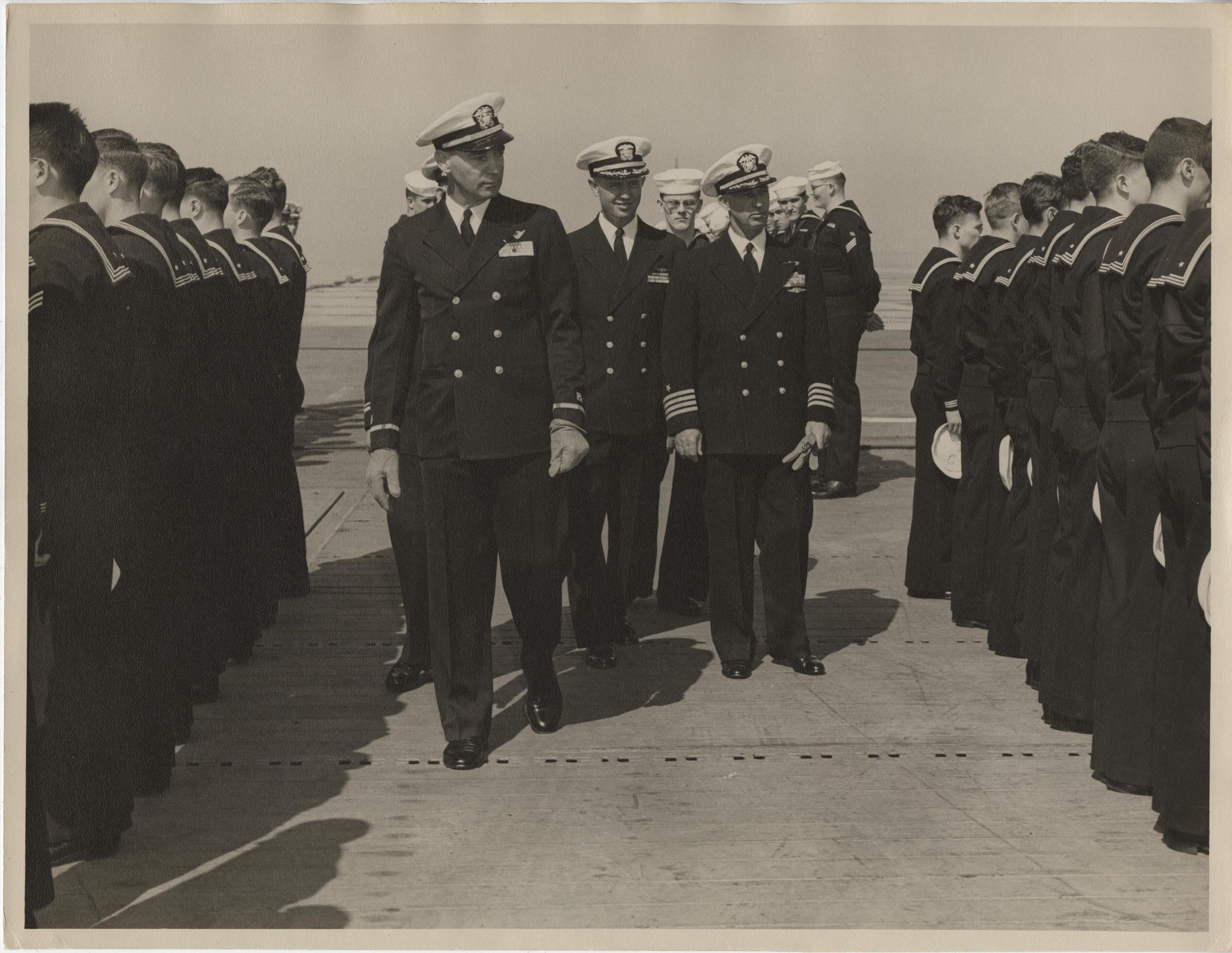 Primary Image of Captain Arnold W. McKechnie and Chief Boatswain George A. Lentz Inspect the Crew Aboard the USS Yorktown (CVA-10)