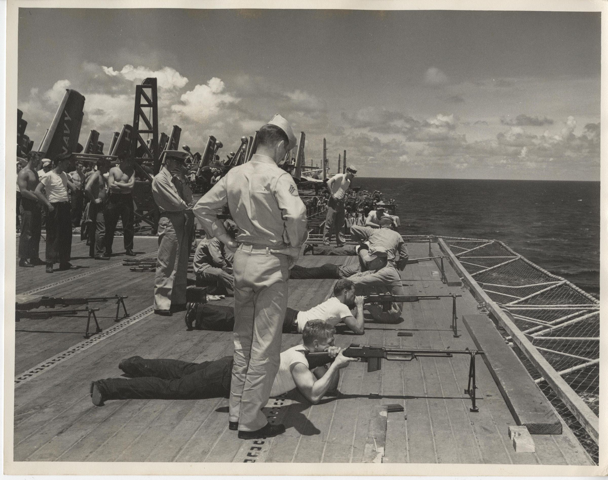 Primary Image of Marines Practice Firing their Rifles from the Flight Deck