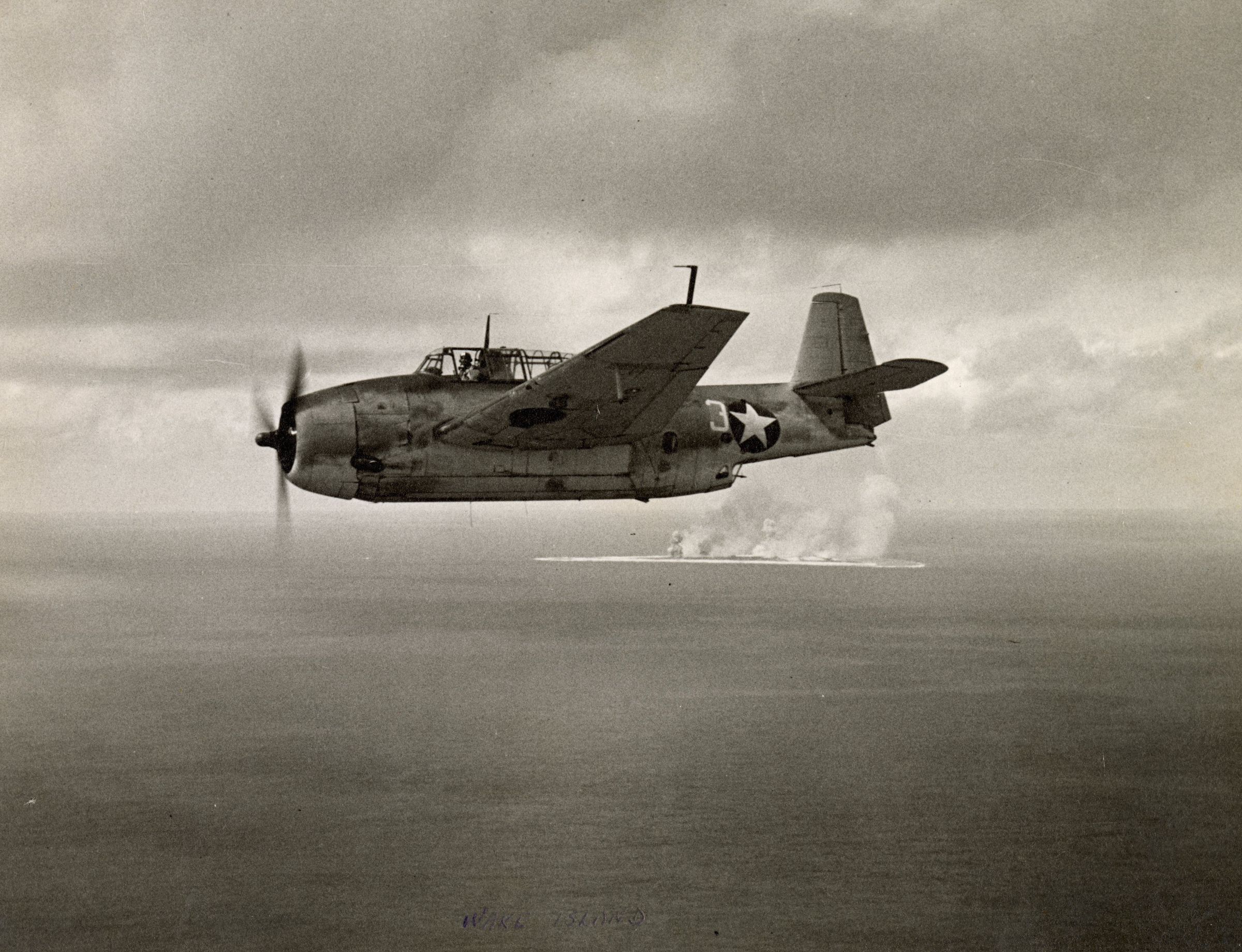 Primary Image of Joseph Kristufek Flying His Avenger Torpedo Plane Past Wake Island