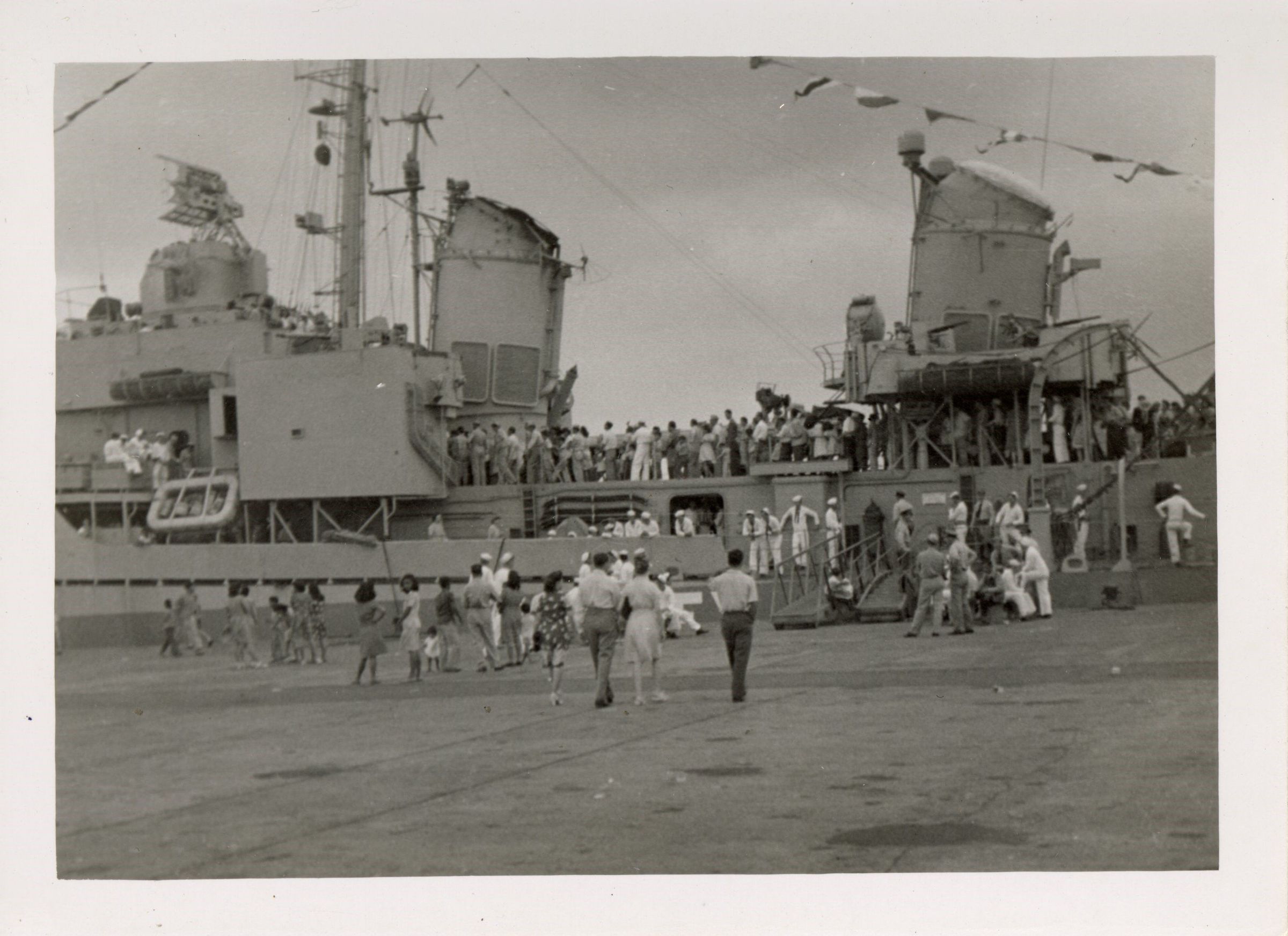 Primary Image of Crowds Come Aboard the Newly Repaired Laffey (DD-724)