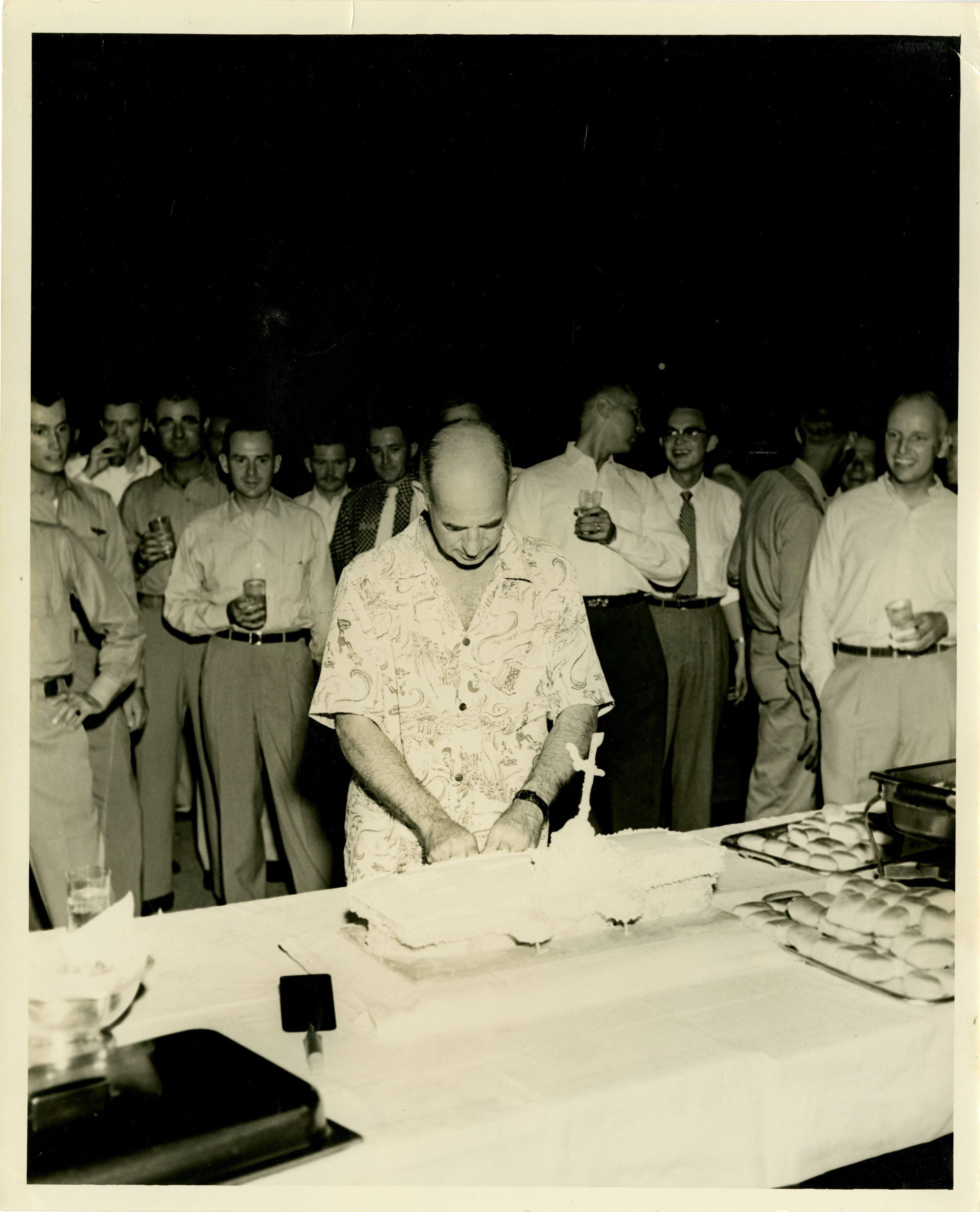 Primary Image of Captain Arnold McKechnie Cutting His Farewell Cake