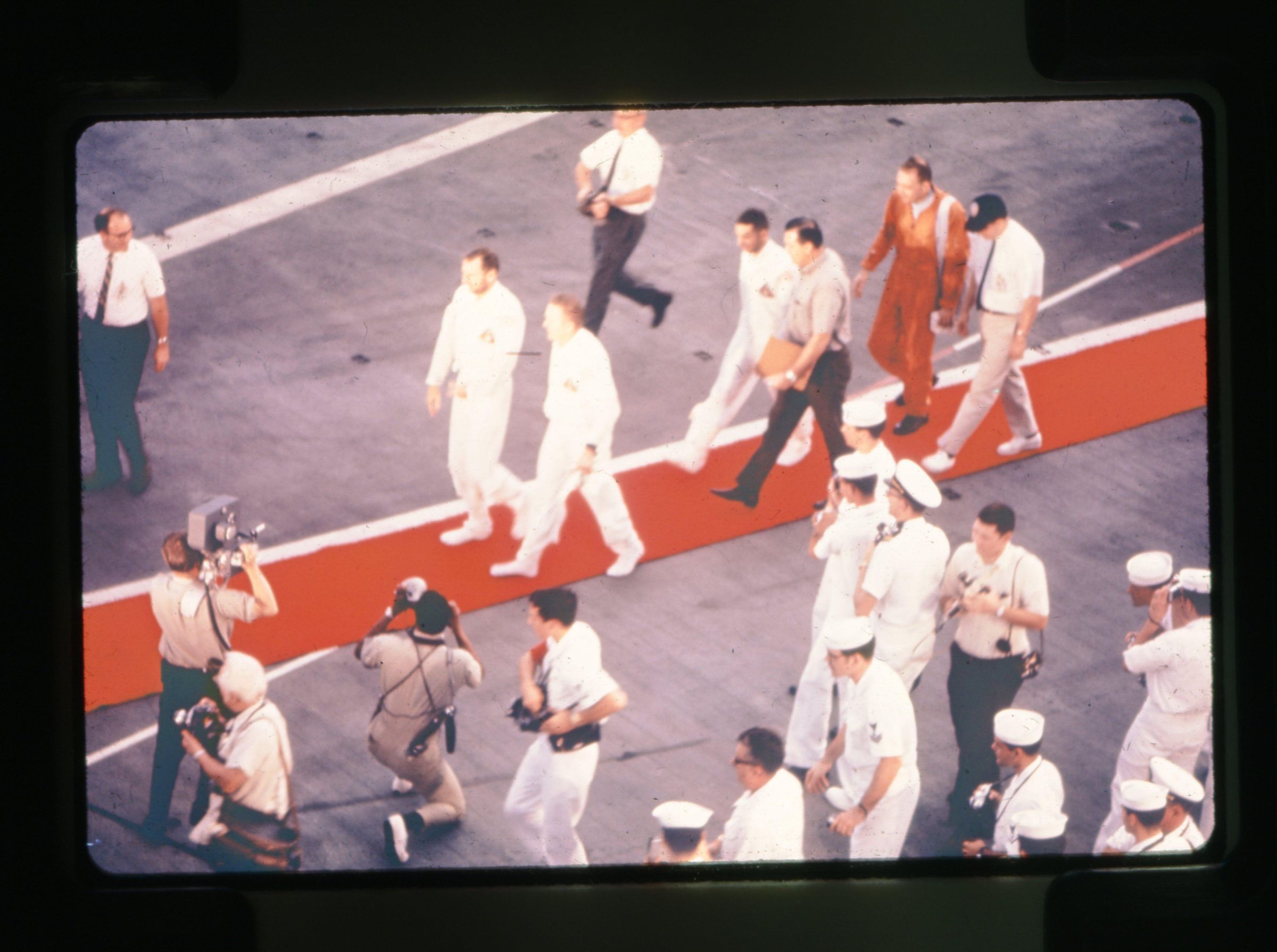 Primary Image of Apollo 8 Astronauts Walk Across the Flightdeck