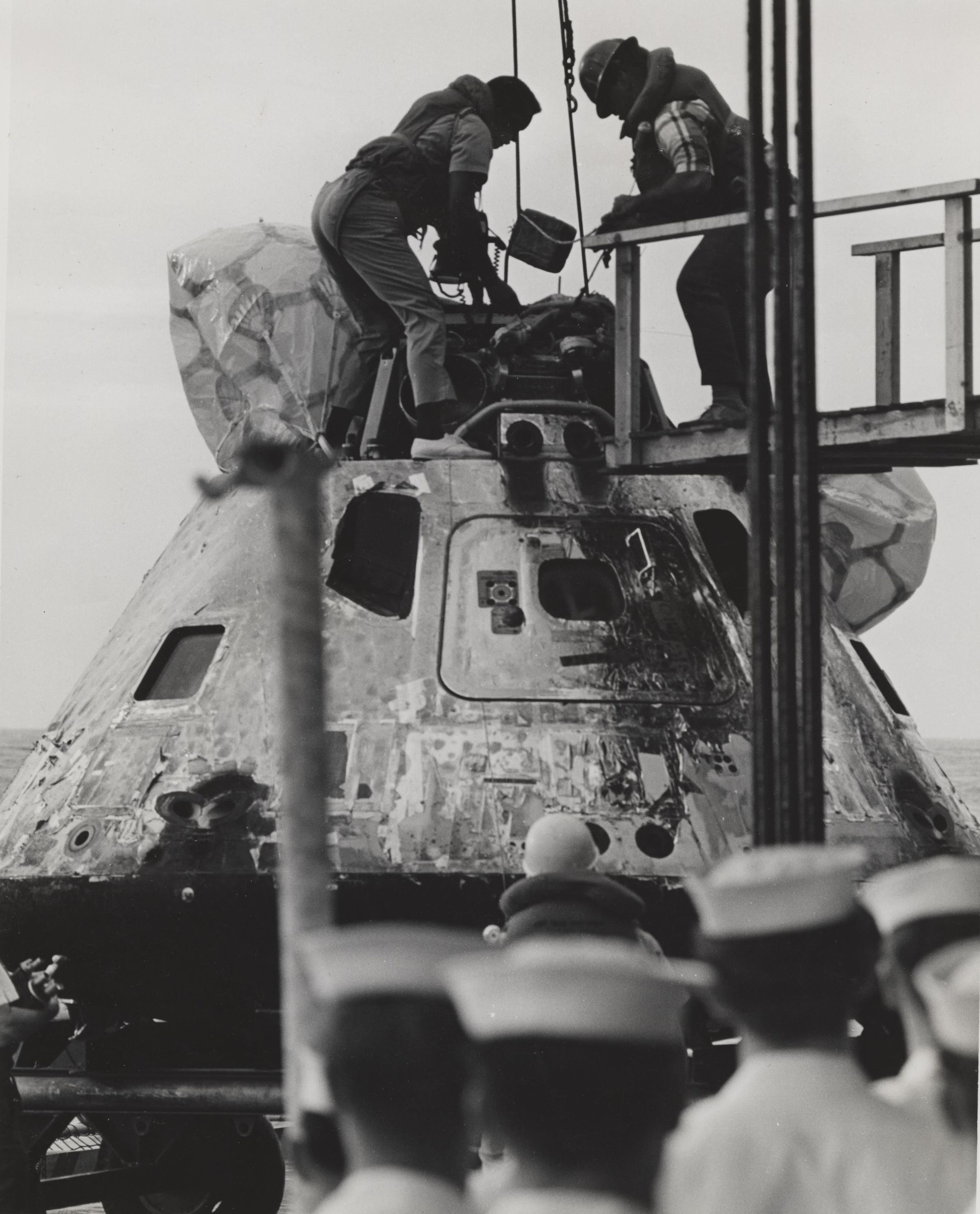 Primary Image of The Crew of The USS Yorktown (CVS-10) Work to Unhook Apollo 8