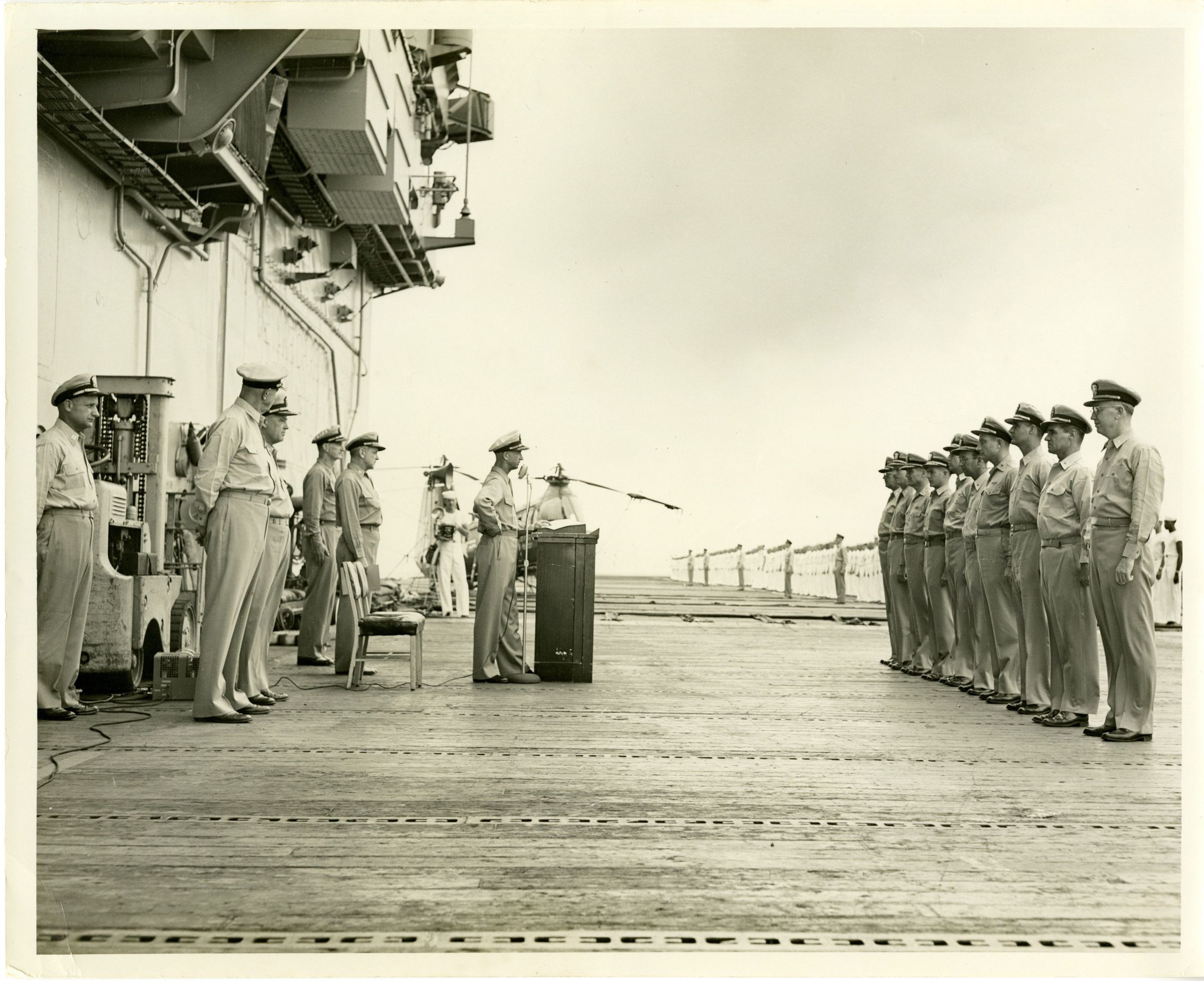 Primary Image of Captain Arnold McKechnie Addressing the Crew of the USS Yorktown (CVA-10)