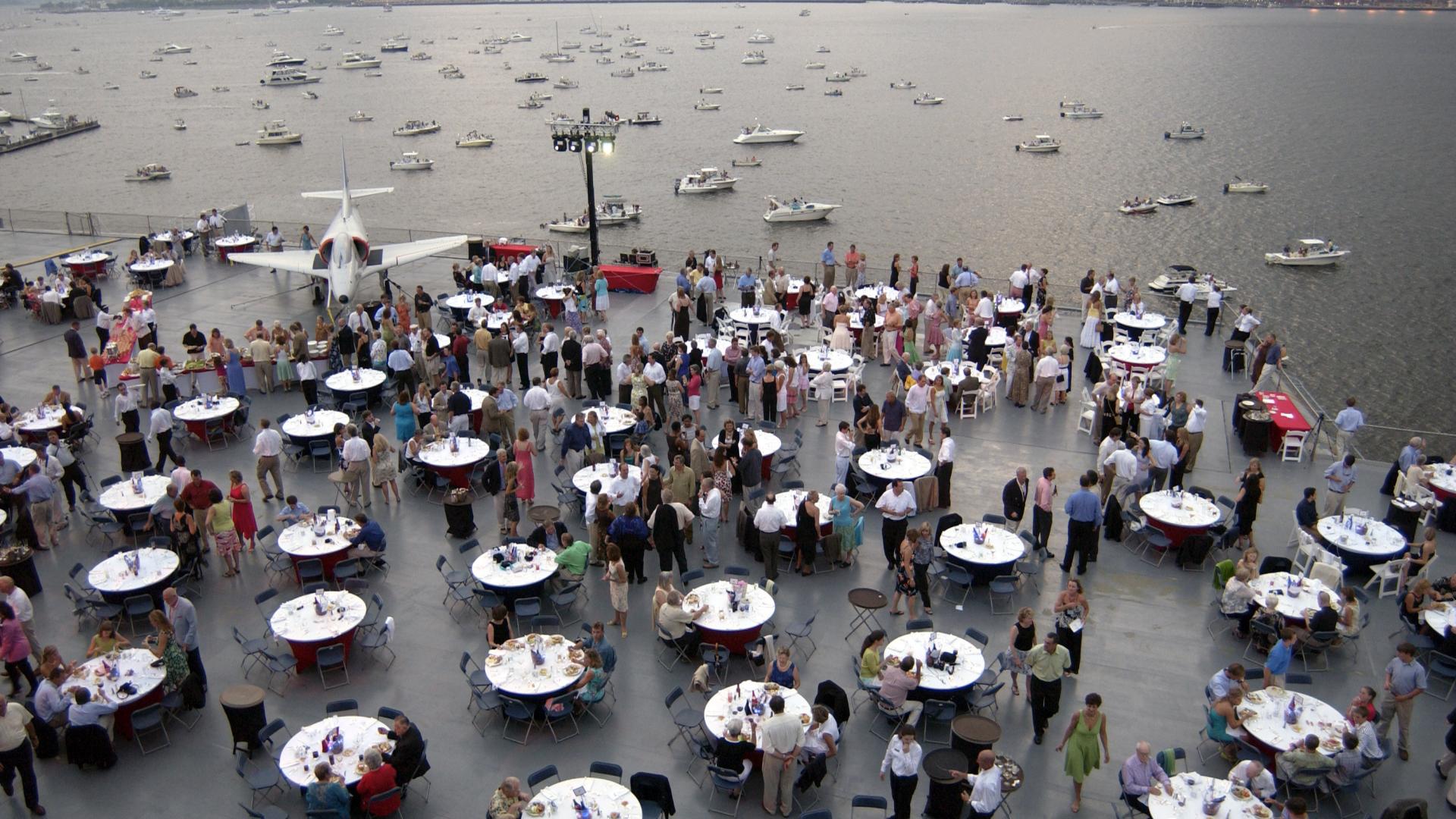 Tables set up for an event on the flight deck