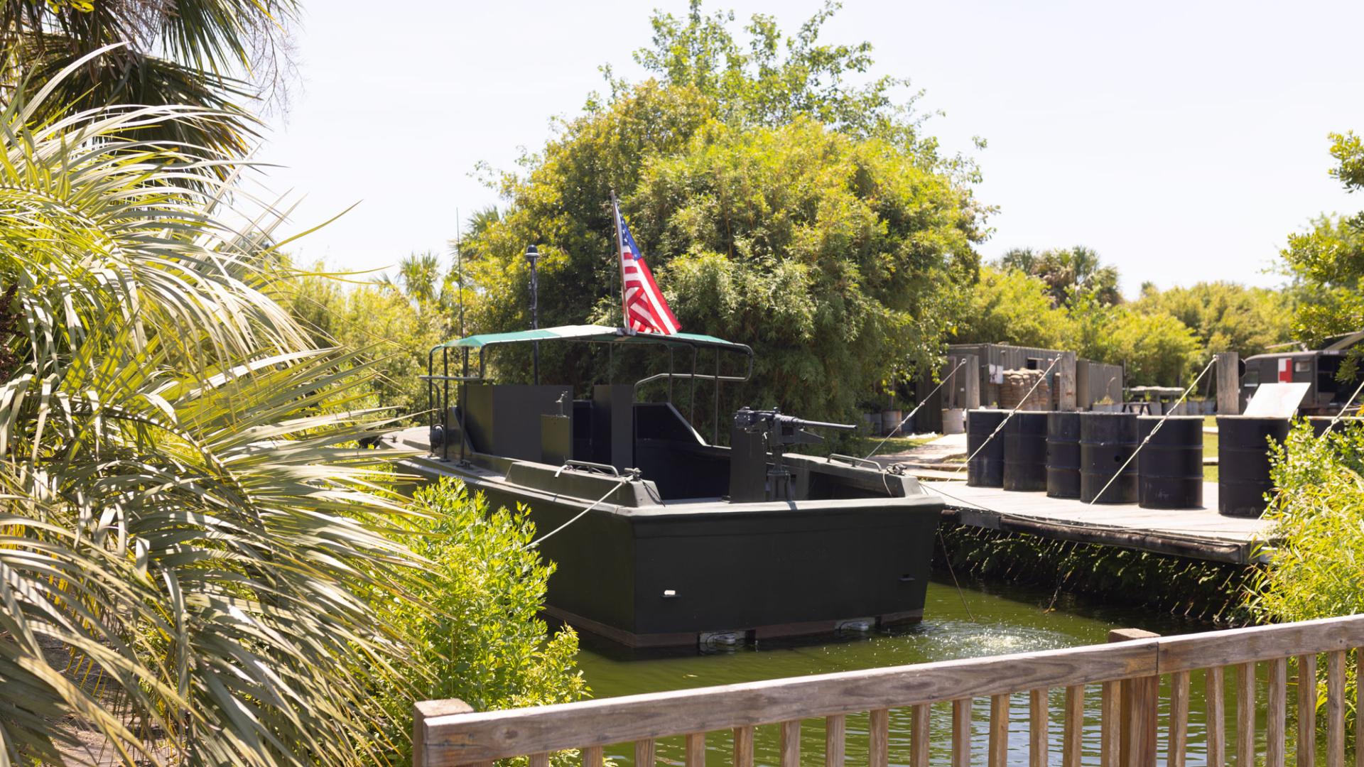 image of a river boat used in the Vietnam War sitting in water