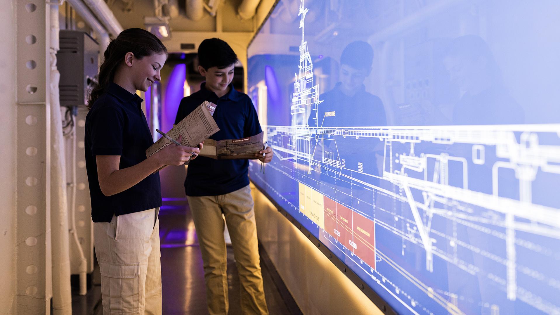 A boy and a girl in the Engine Room Experience