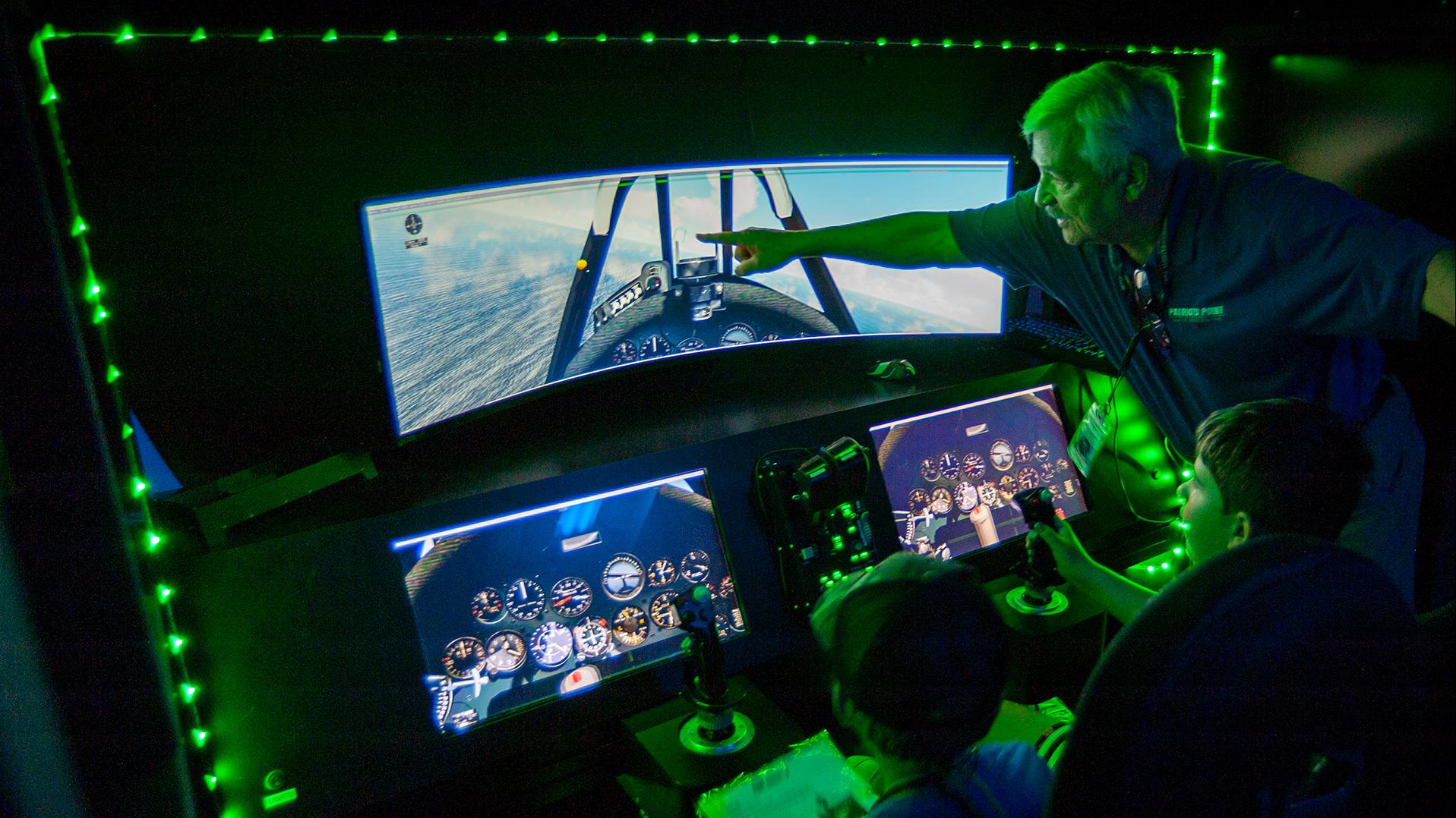 Two boys using the Flight Academy