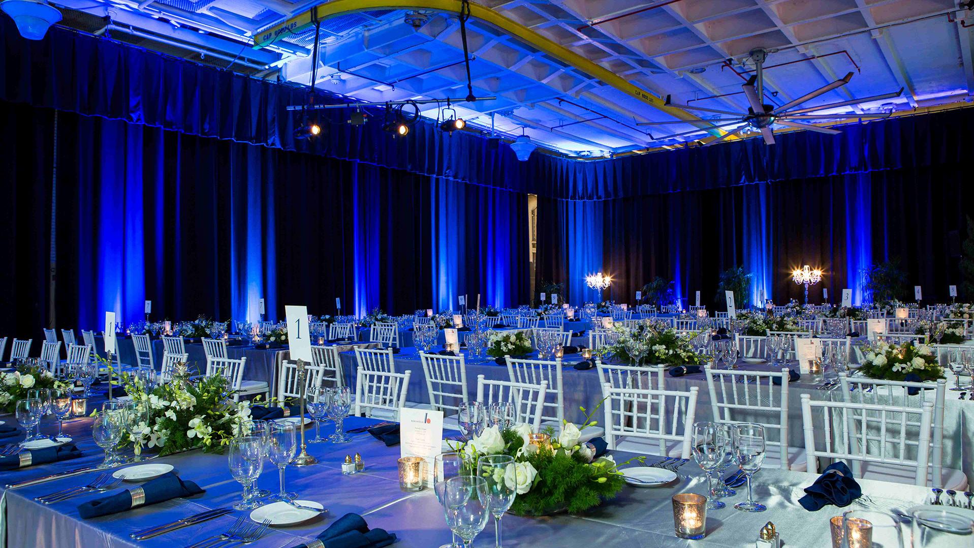 Long tables set up in the Hangar Bay