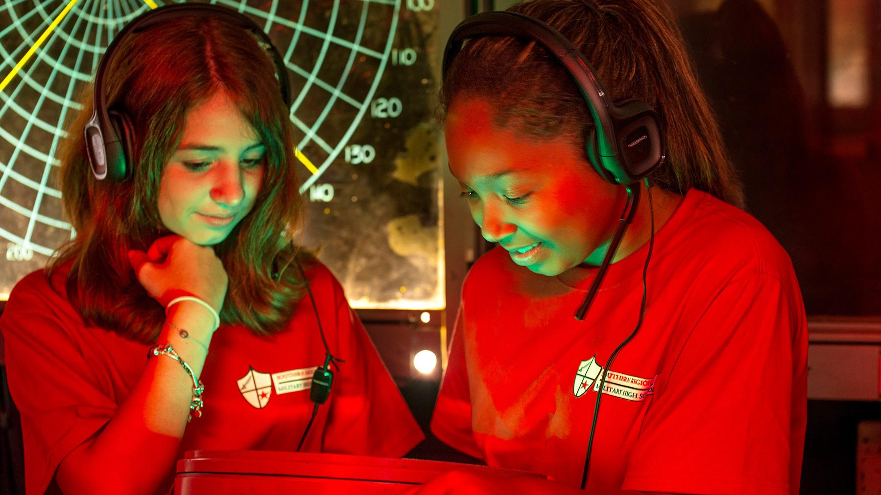 Two girls looking at a screen