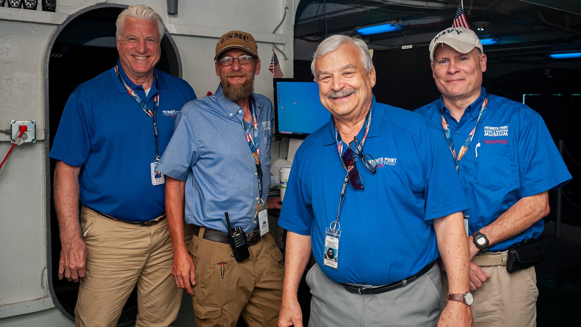 Four male Patriots Point volunteers