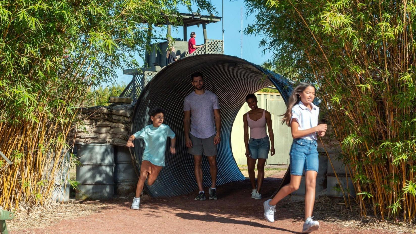 Family going through the tunnel at the Vietnam Experience