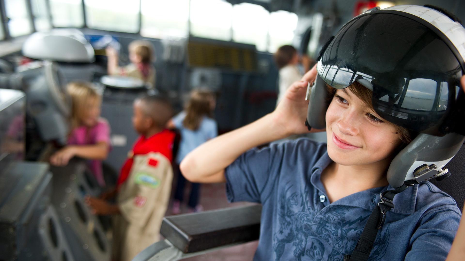 Young boy in a flight helmet