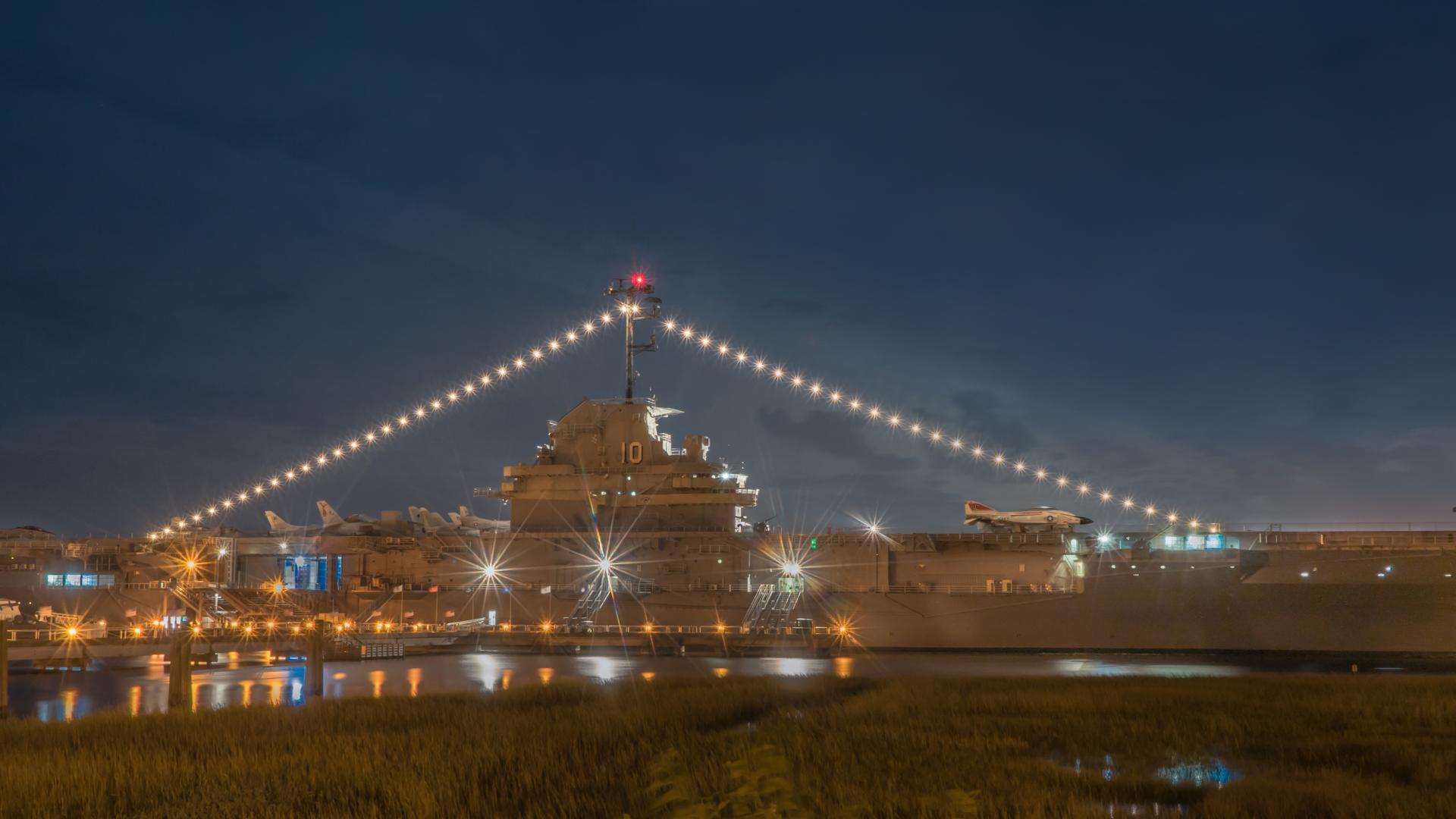 View of the USS Yorktown at night.