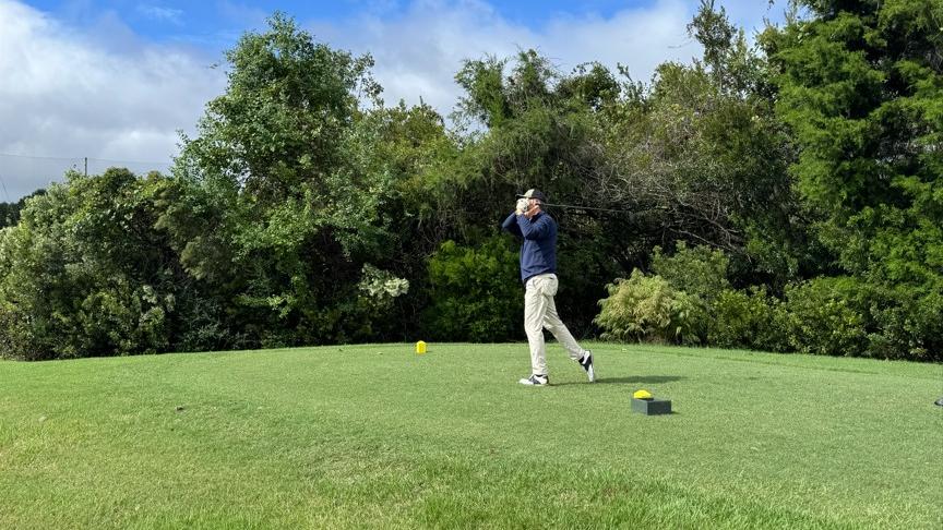 A man golfing
