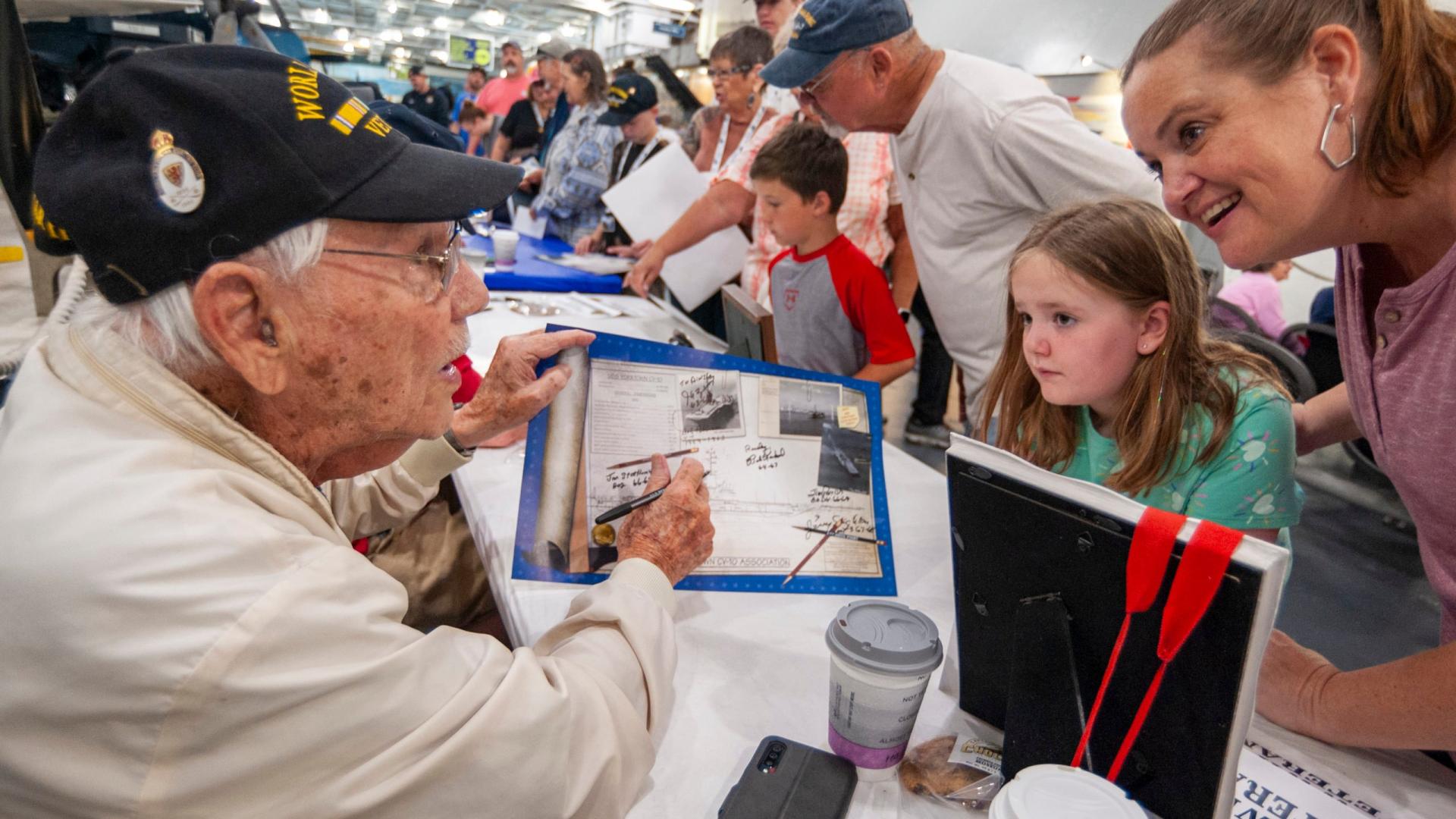 A Veteran speaking with some visitors