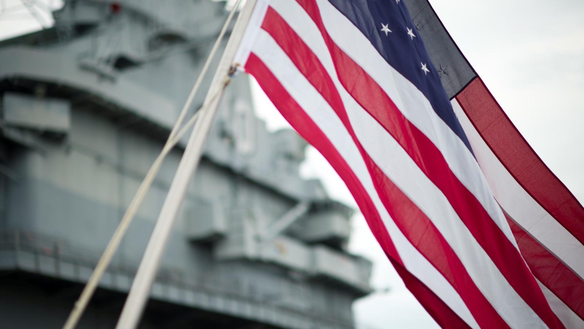 American Flag waving in front of Patriots Point