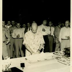 Primary Image of Captain Arnold McKechnie Cutting His Farewell Cake
