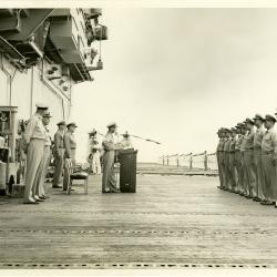 Primary Image of Captain Arnold McKechnie Addressing the Crew of the USS Yorktown (CVA-10)