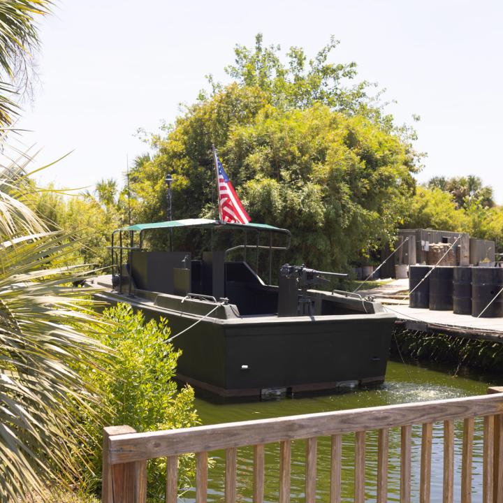 image of a river boat used in the Vietnam War sitting in water