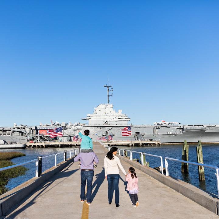 Family walking towards Patriots Point