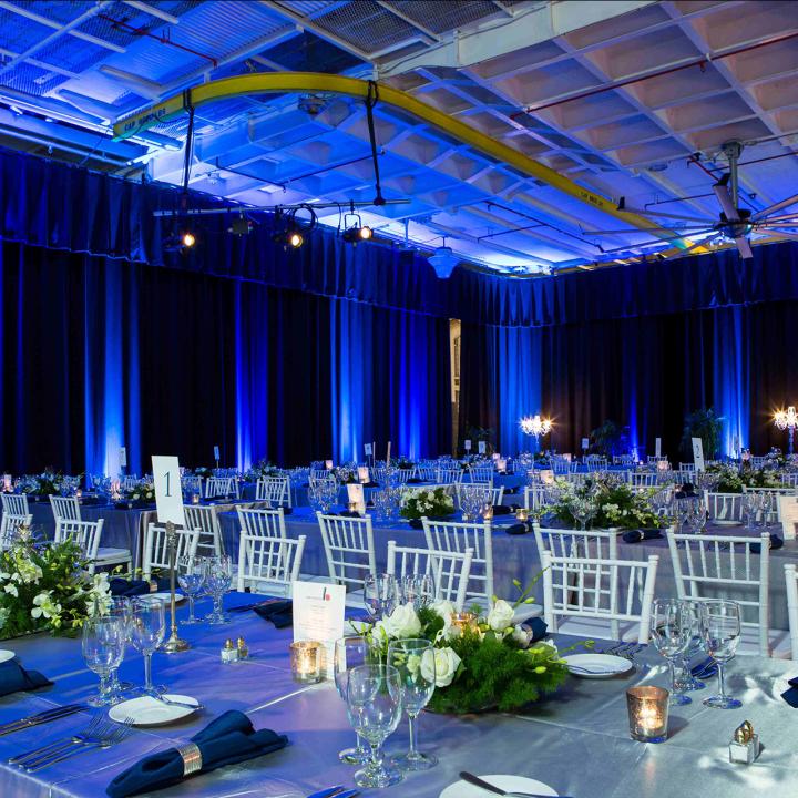 Long tables set up in the Hangar Bay