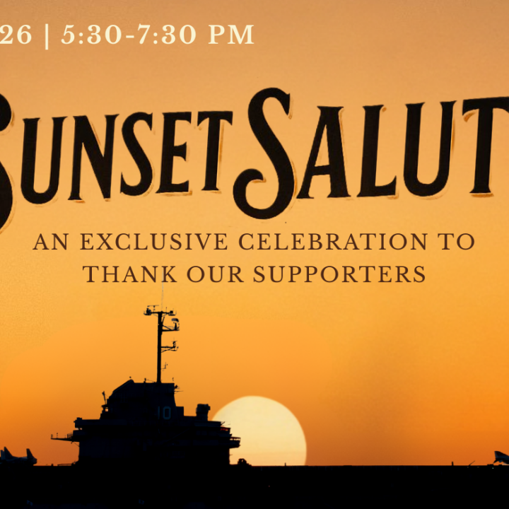 Naval aircraft carrier with sunset backdrop.