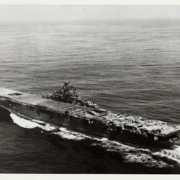 Primary Image of A Damaged USS Franklin (CV-13) Headed Home