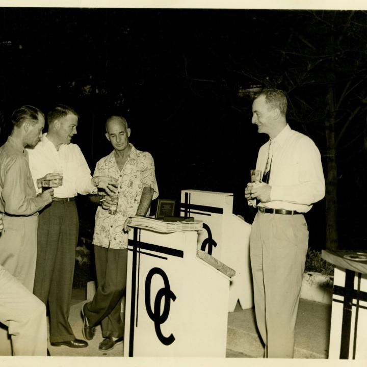 Primary Image of Captain Arnold McKechnie Receiving Gifts at his Farewell Party