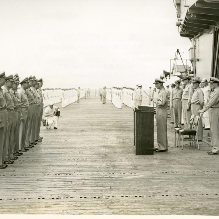 Primary Image of Captain Arnold McKechnie Reading his Final Orders at the Changing of Command Ceremony