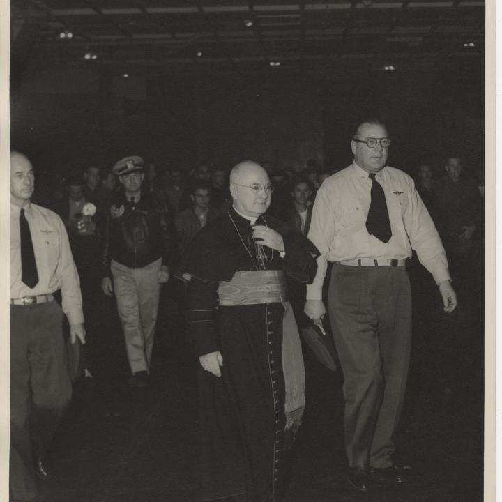 Primary Image of Captain McKechnie on the Hangar Deck with Cardinal Francis Spellman