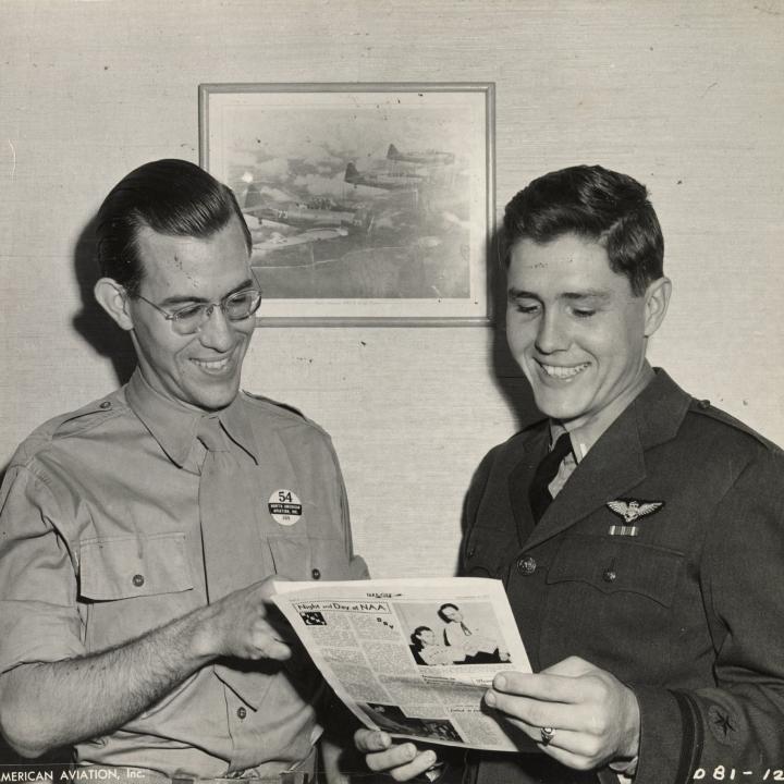 Primary Image of Elisha "Smokey" Stover Standing Alongside an Unidentified Official from North American Aviation