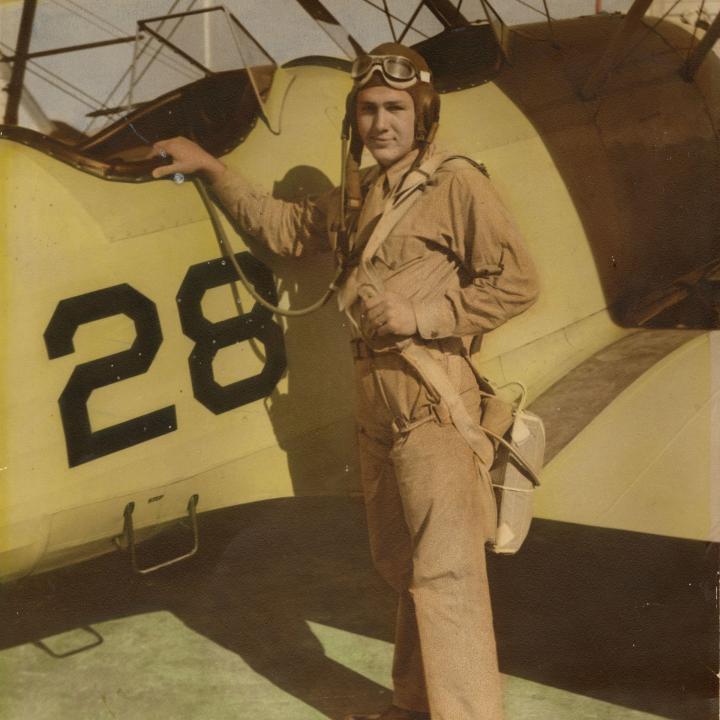 Primary Image of Elisha "Smokey" Stover Standing in Front of a Stearman Biplane