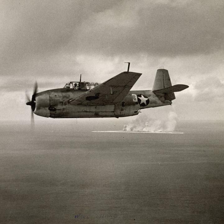 Primary Image of Joseph Kristufek Flying His Avenger Torpedo Plane Past Wake Island