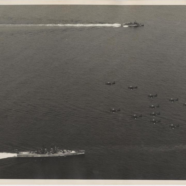 Primary Image of Skyraiders Flying Over Part of a Carrier Task Force