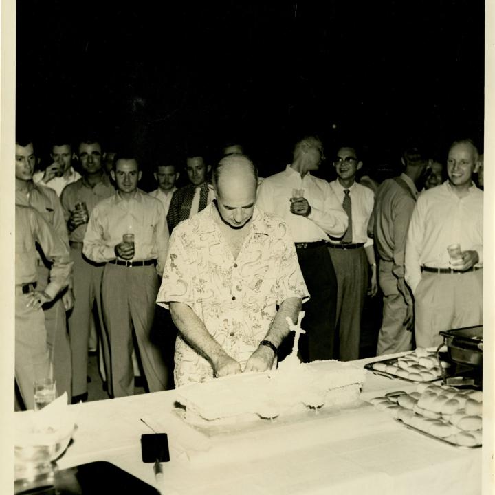 Primary Image of Captain Arnold McKechnie Cutting His Farewell Cake