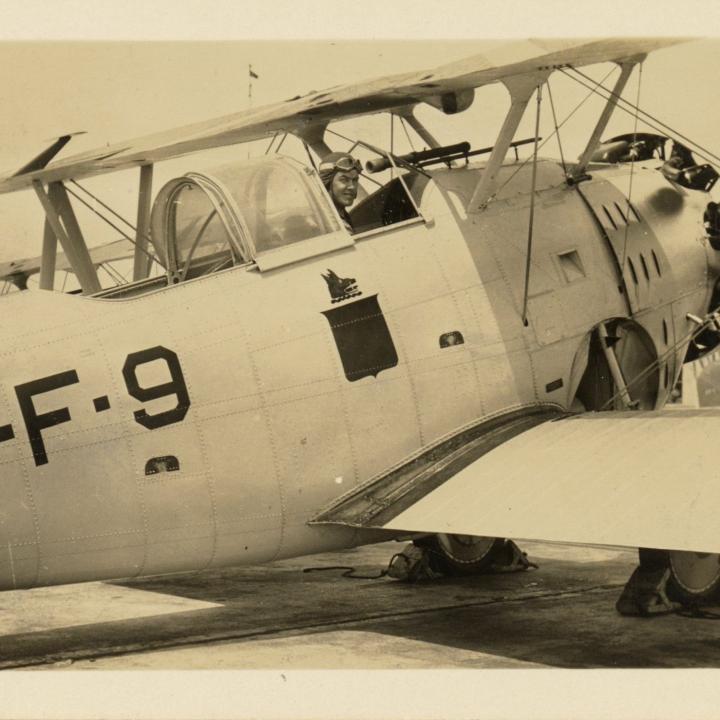 Primary Image of James H. Flatley Jr. in the Cockpit of a Grumman FF-1 Biplane