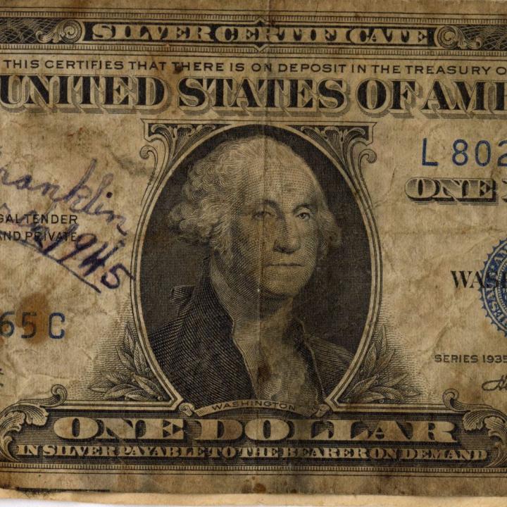 Primary Image of Burnt Dollar Found after the USS Franklin (CV-13) Disaster