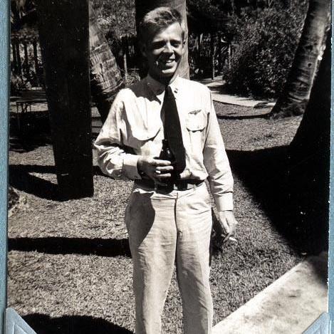 Primary Image of Don Knapp Holding a Beer and Cigarette