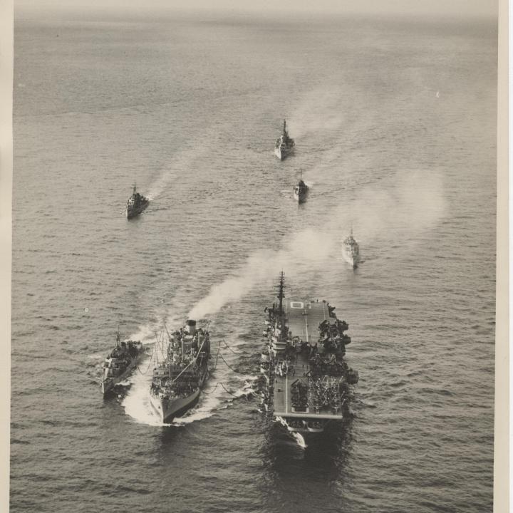 Primary Image of USS Yorktown (CVA-10) and USS Daly (DD-519) Being Refueled by a Supply Ship
