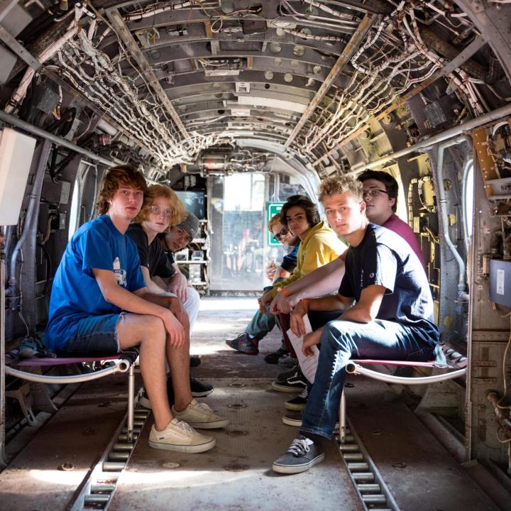 Kids hanging out in an aircraft during Operation Overnight