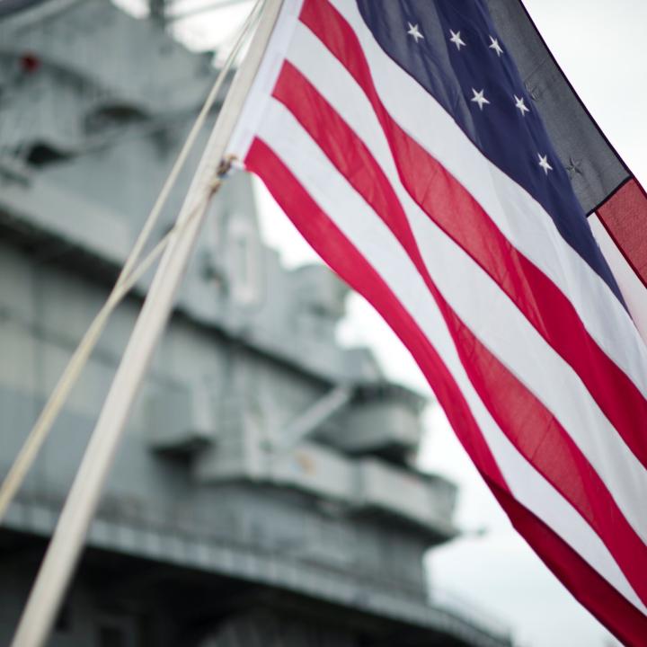 American Flag waving in front of Patriots Point