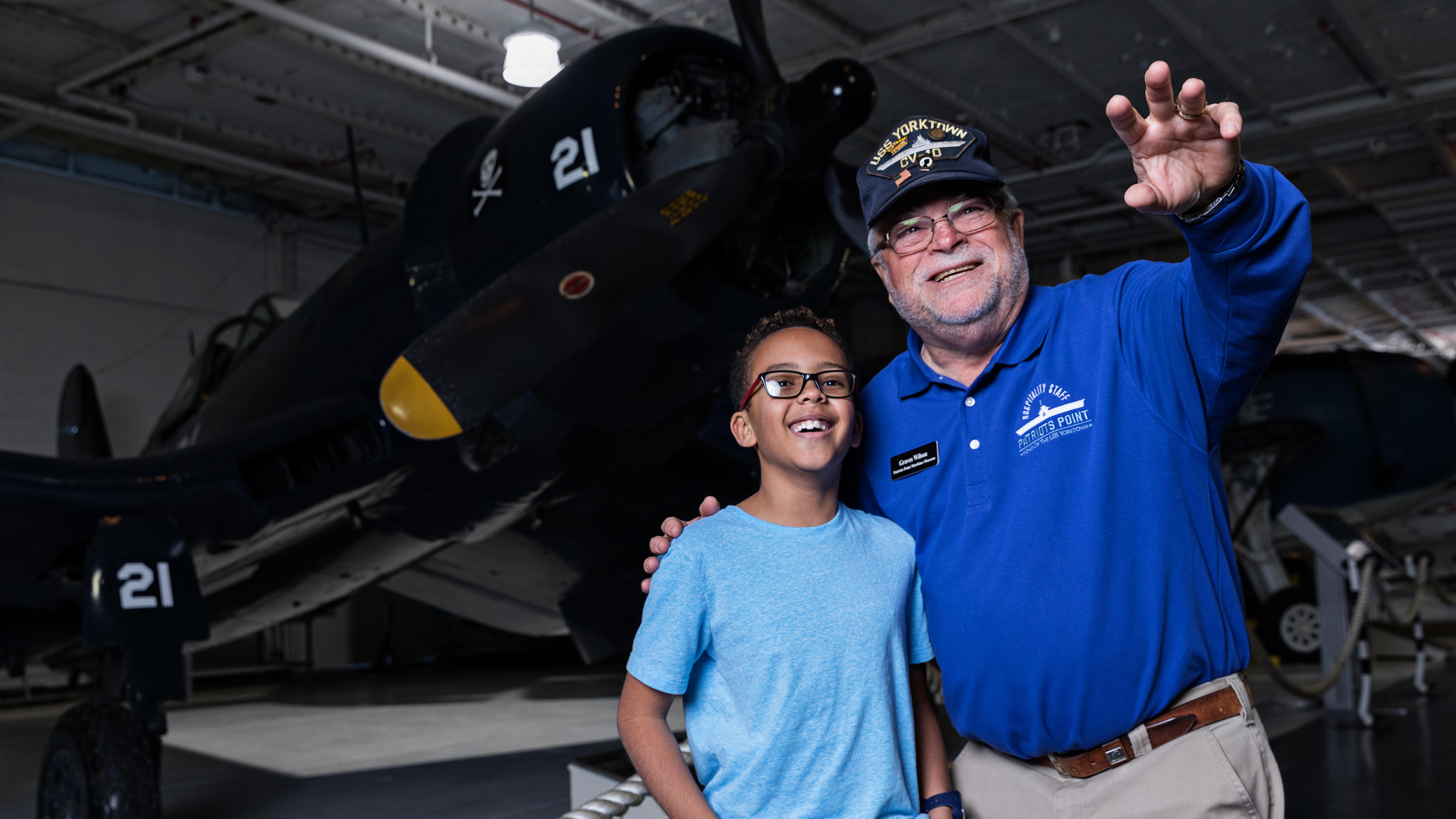 Volunteer showing child hangar bays