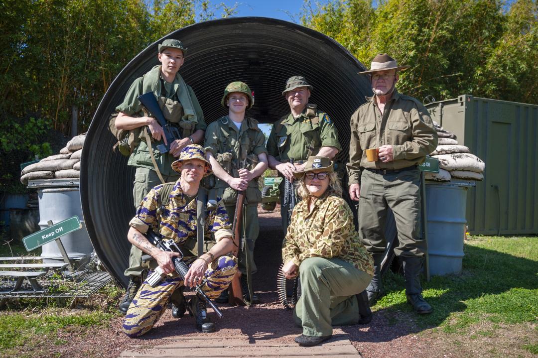 A group of historical reenactors pose in the Vietnam Experience. 