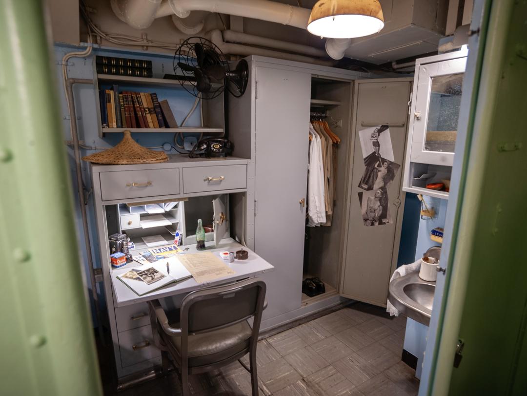 Looking into officer's stateroom with displayed personal items 